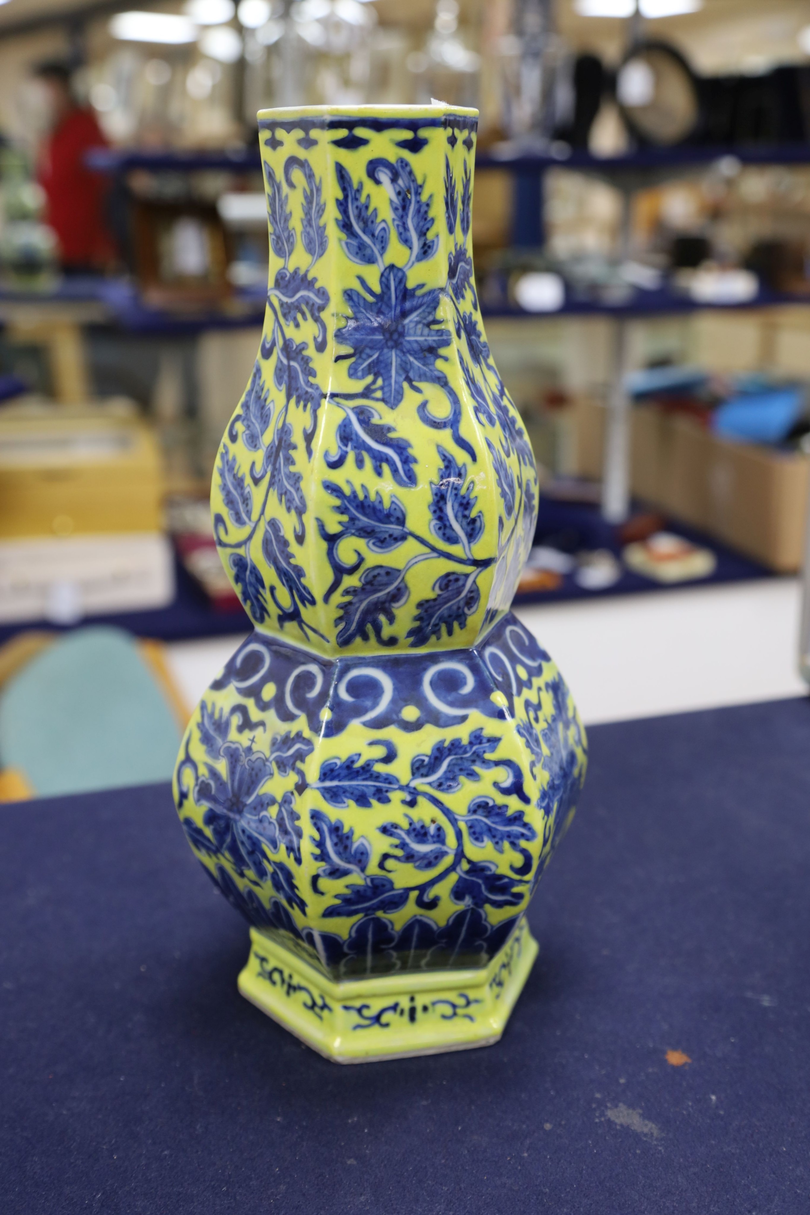 A Chinese underglaze blue yellow ground hexagonal vase, early 20th century, some restoration 35cm